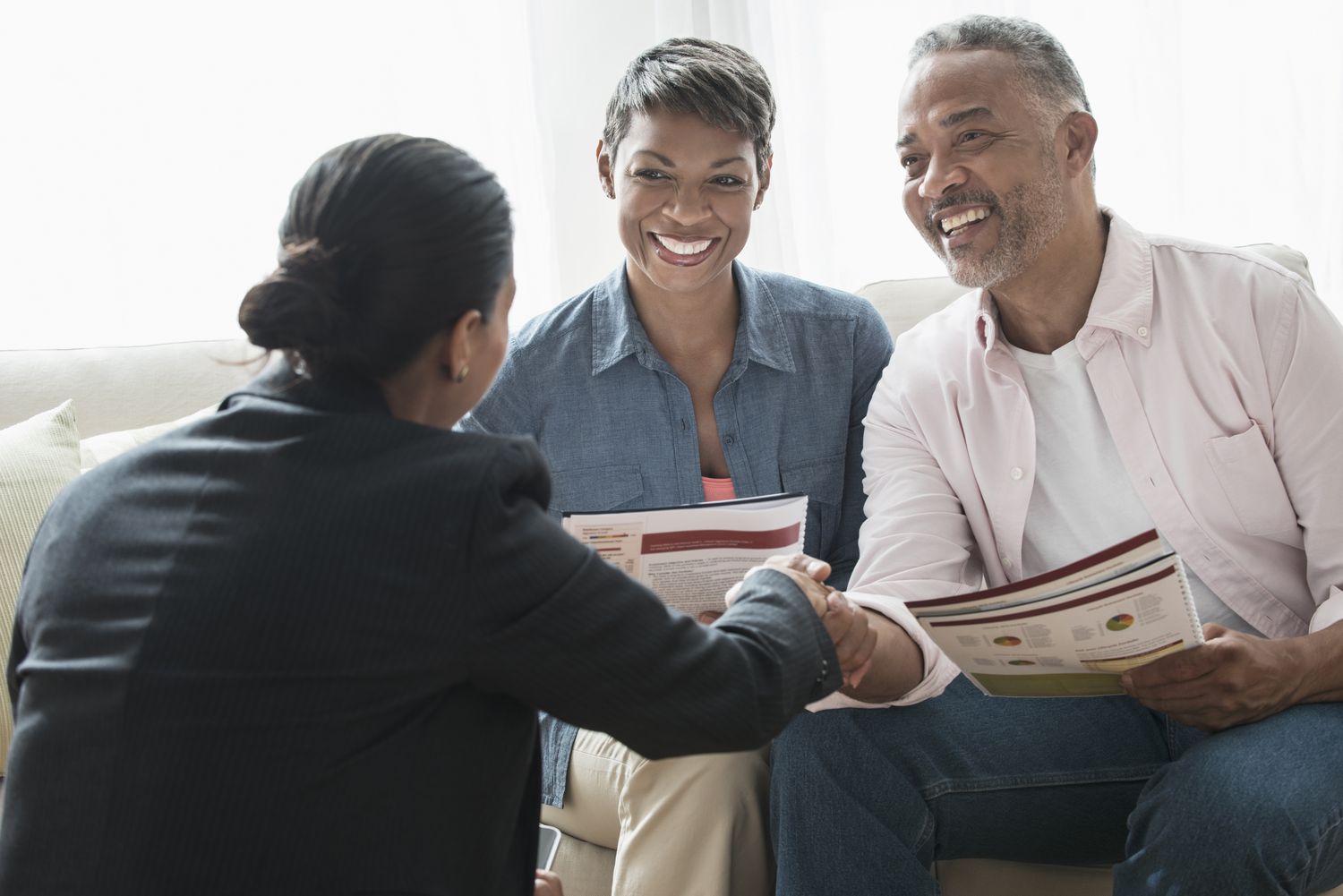 African-American couple talking to businesswoman