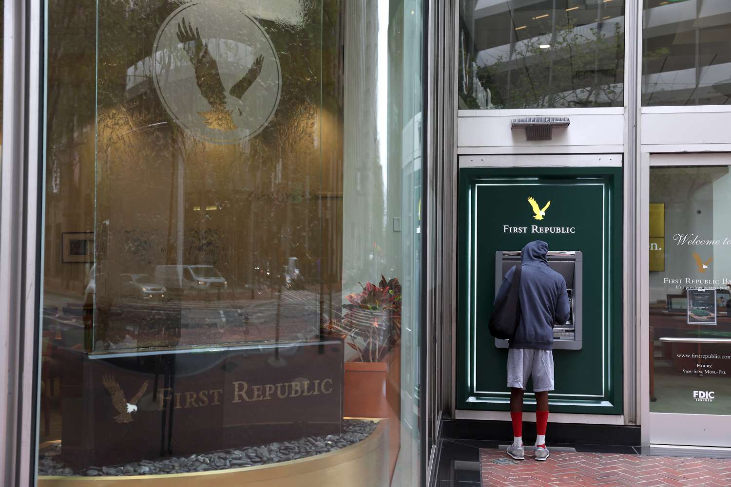  A First Republic Bank customer uses an ATM on May 01, 2023 in San Francisco, California. Federal Regulators seized troubled lender First Republic Bank on Monday and sold all of its deposits and most of its assets to JPMorgan Chase. First Republic becomes the second largest bank in U.S. history to fail since Washington Mutual failed in 2008.