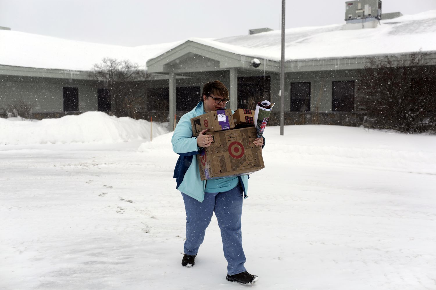 Amanda Downey is seen carrying boxes from her office after being fired from her federal job at the Forest Service in Cadillac, MI., on Monday, February 17, 2025. Downey is among thousands of federal employees who lost their jobs due to their "performance" but boasted excellent track records.