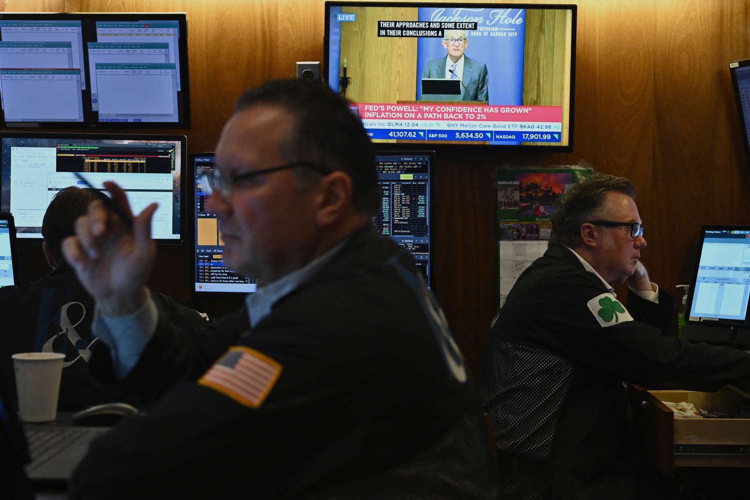 A television station broadcasts US Federal Reserve Chair Chair Jerome Powell speaking in Jackson Hole, Wyoming, on the floor of the New York Stock Exchange.