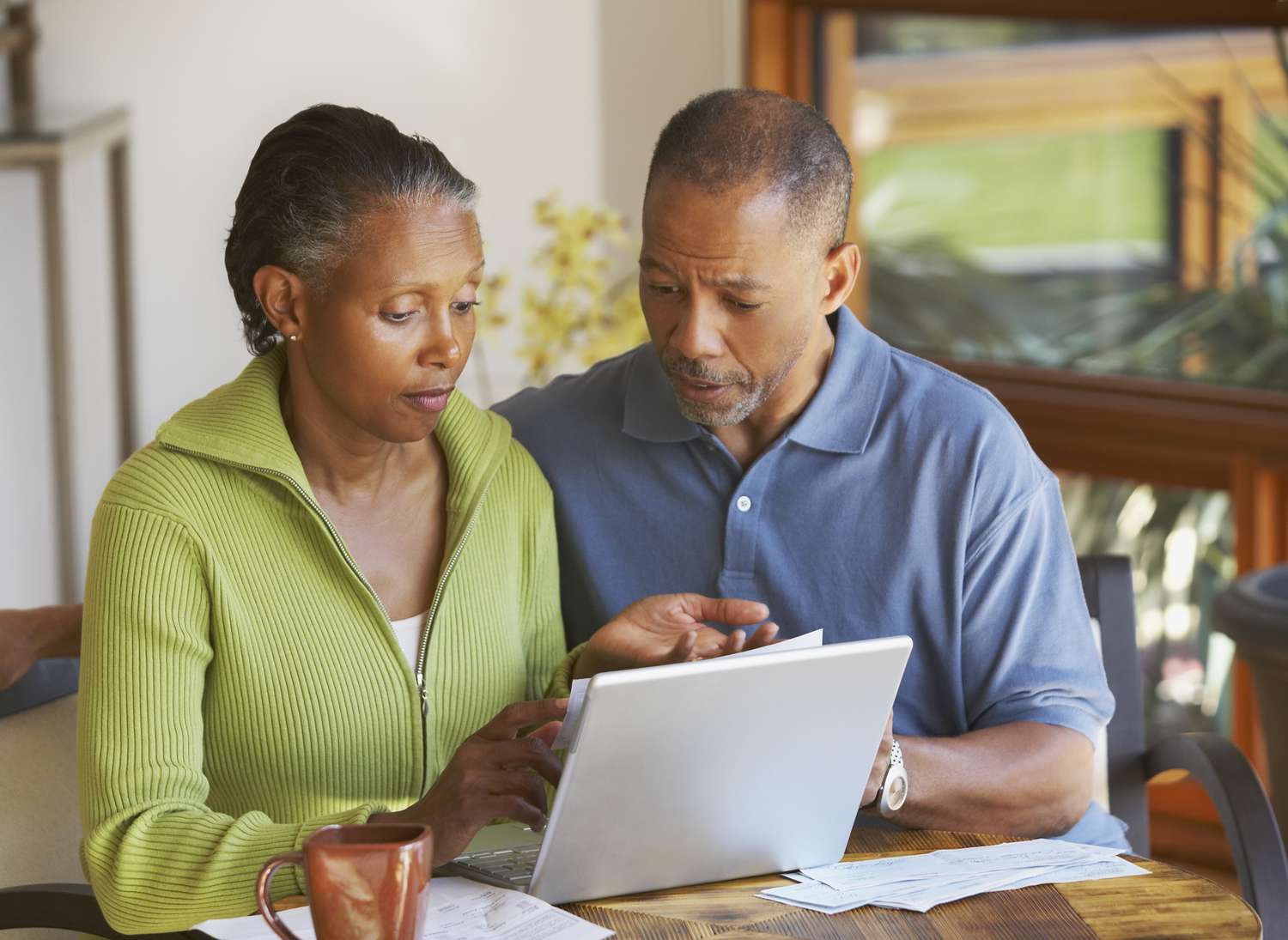 Older couple checking what the maturity event is for their reverse mortgage.
