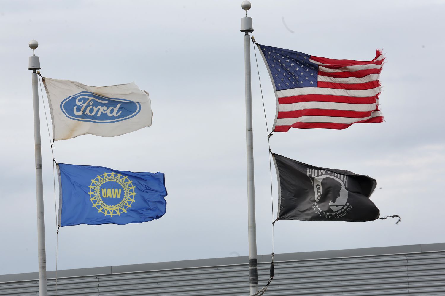 Flags outside of a Ford Chicago plant.