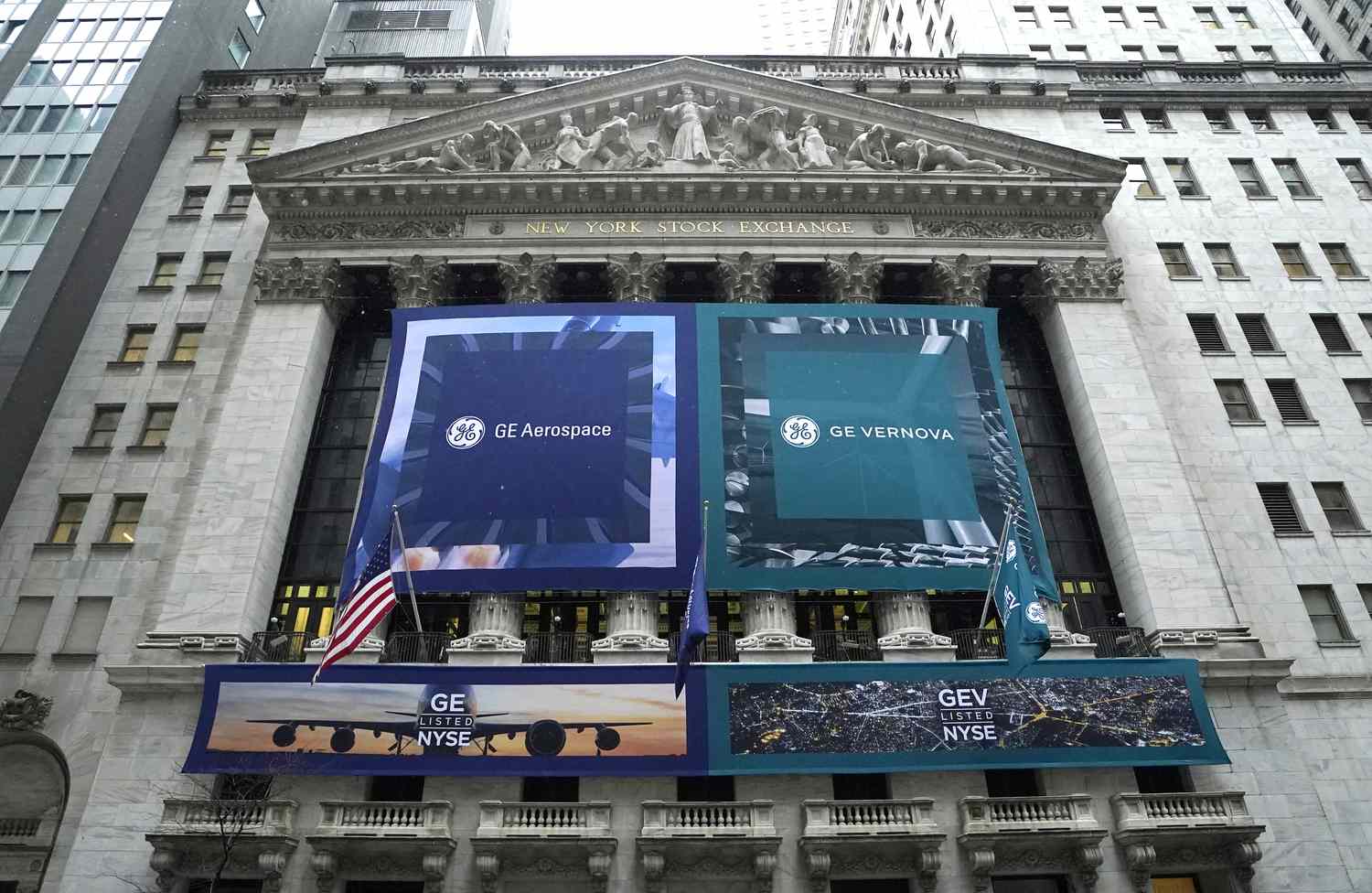 Banners of the newly-formed and independent General Electric (GE) companies are displayed in front of the New York Stock Exchange (NYSE) on April 2, 2024