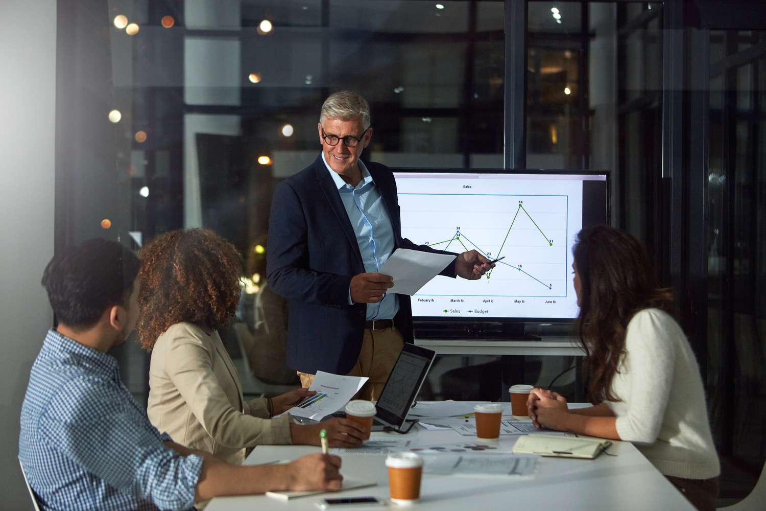 Businessman giving a presentation to his colleagues in the boardroom.