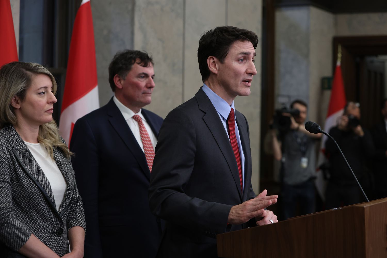 Justin Trudeau, Canada's prime minister, right, speaks during a press conference with Melanie Joly, Canada's foreign minister, left, and Dominic LeBlanc, Canada's finance and intergovernmental affairs minister, on Parliament Hill in Ottawa, Ontario, Canada, on Saturday, Feb. 1, 2025.