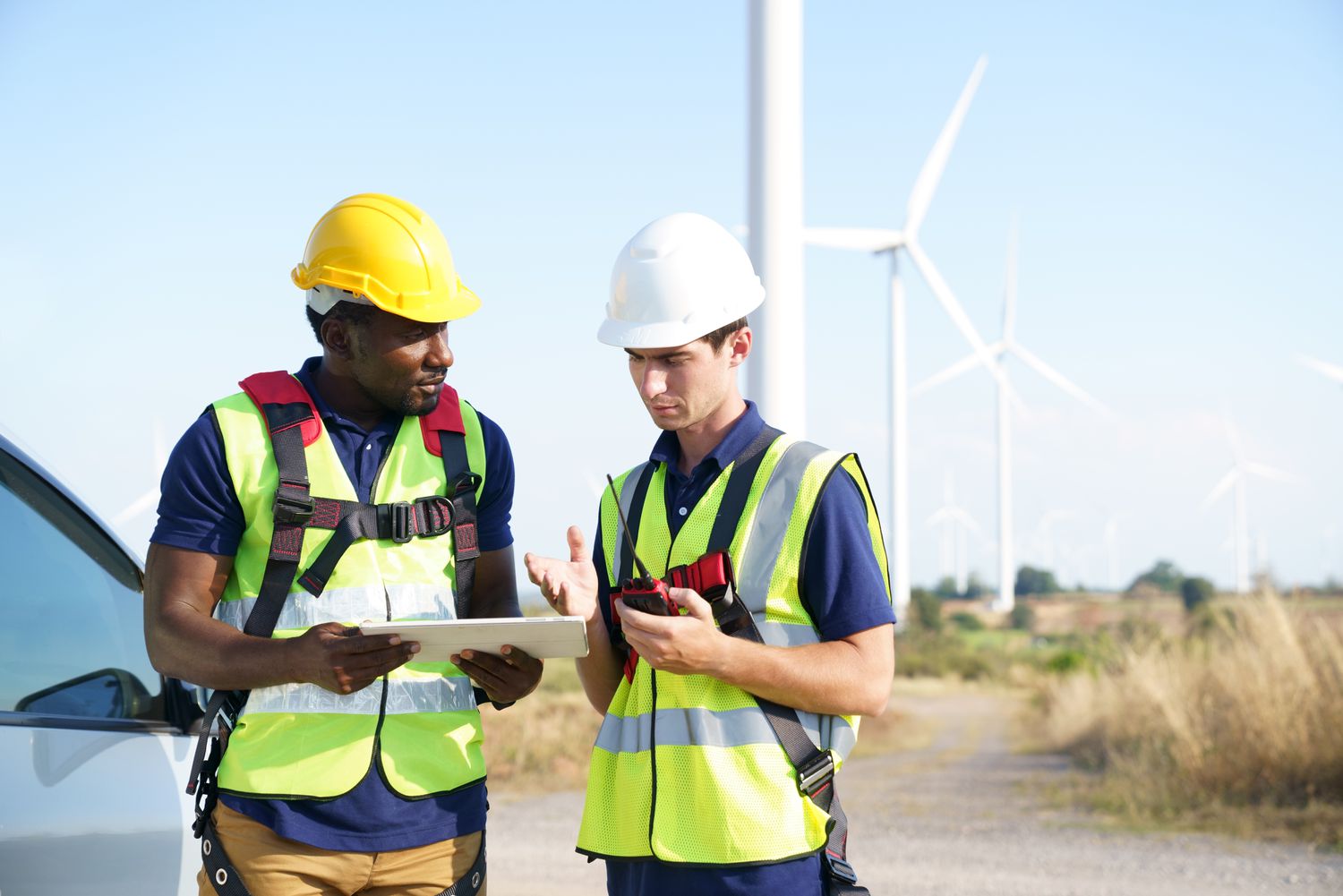 Wind turbine engineers team researching and managing development of wind turbines farm