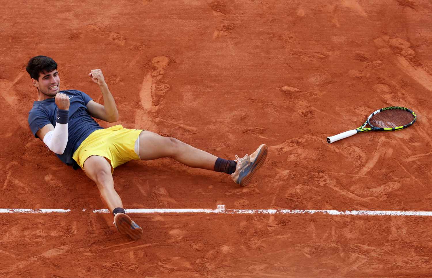 Carlos Alcaraz of Spain celebrates winning match point against Alexander Zverev of Germany during the Men's Singles Final match on Day 15 of the 2024 French Open at Roland Garros on June 9, 2024 in Paris, France