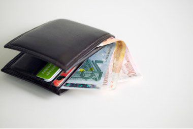 A wallet full of cards and bills