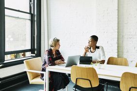 Businesswoman meeting with financial advisor in office conference room