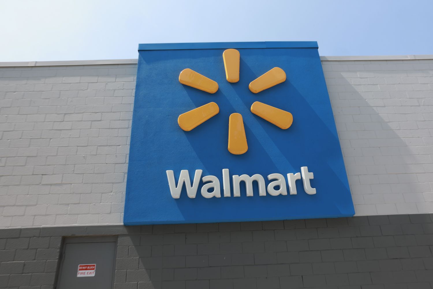  A sign hangs near a Walmart store on May 14, 2024 in Miami, Florida