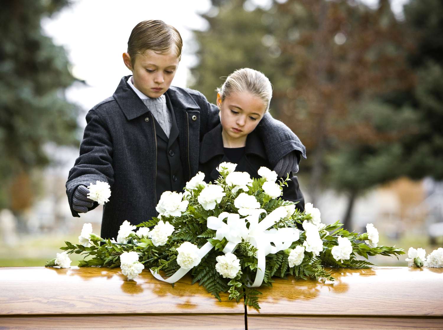 Children in front of casket