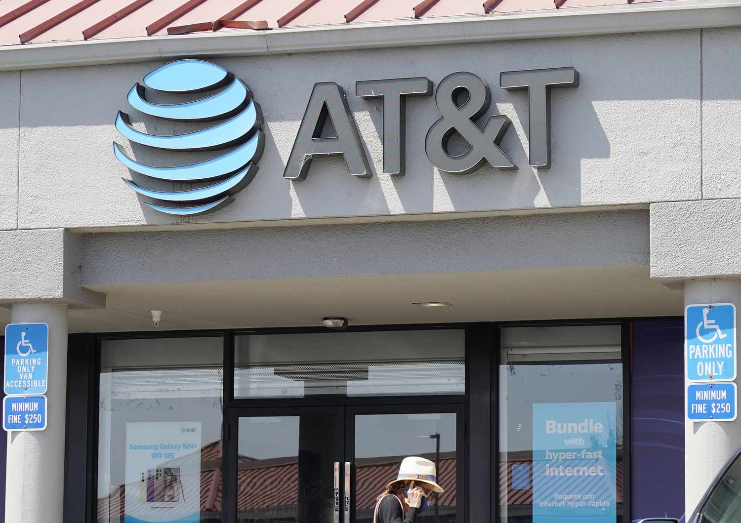 A person walks past an AT&T store in California earlier this month, 