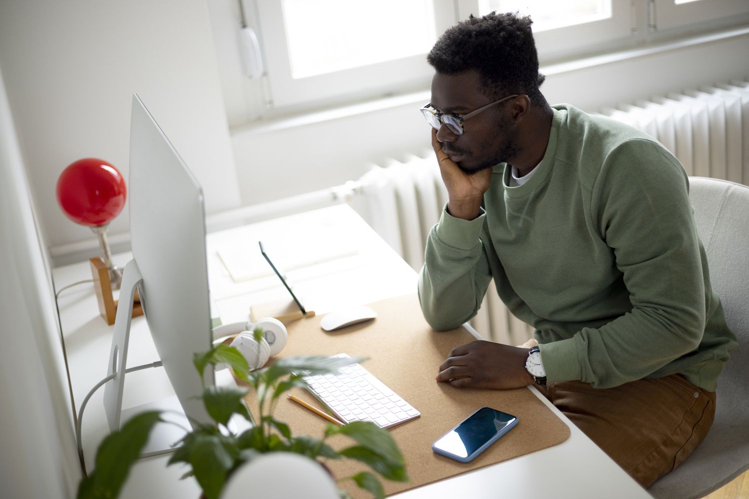Man reading about how Trump's potential shutdown of the Education Department could affect his loans
