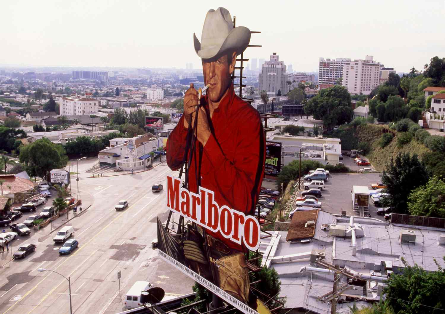 A billboard for Marlboro Cigarettes with the iconic Marlboro Man on Sunset Boulevard.