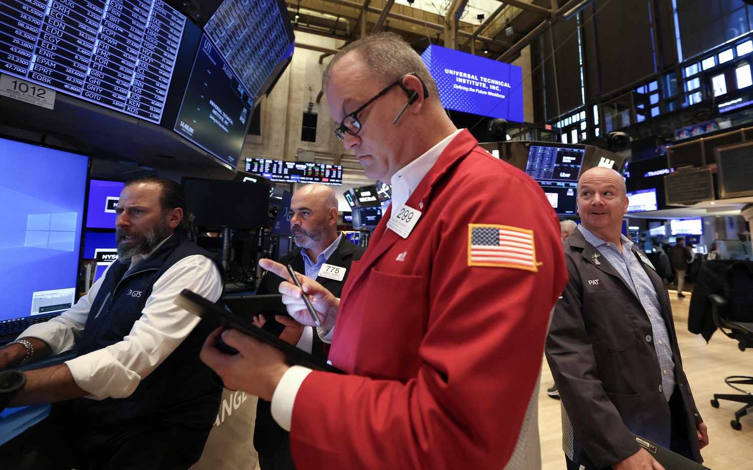 Traders work on the floor of the New York Stock Exchange (NYSE) at the opening bell on May 19, 2025, in New York City.