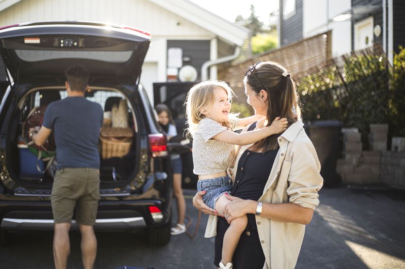 A family packs a car.
