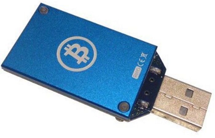A blue USB stick with a bitcoin stamp on it.