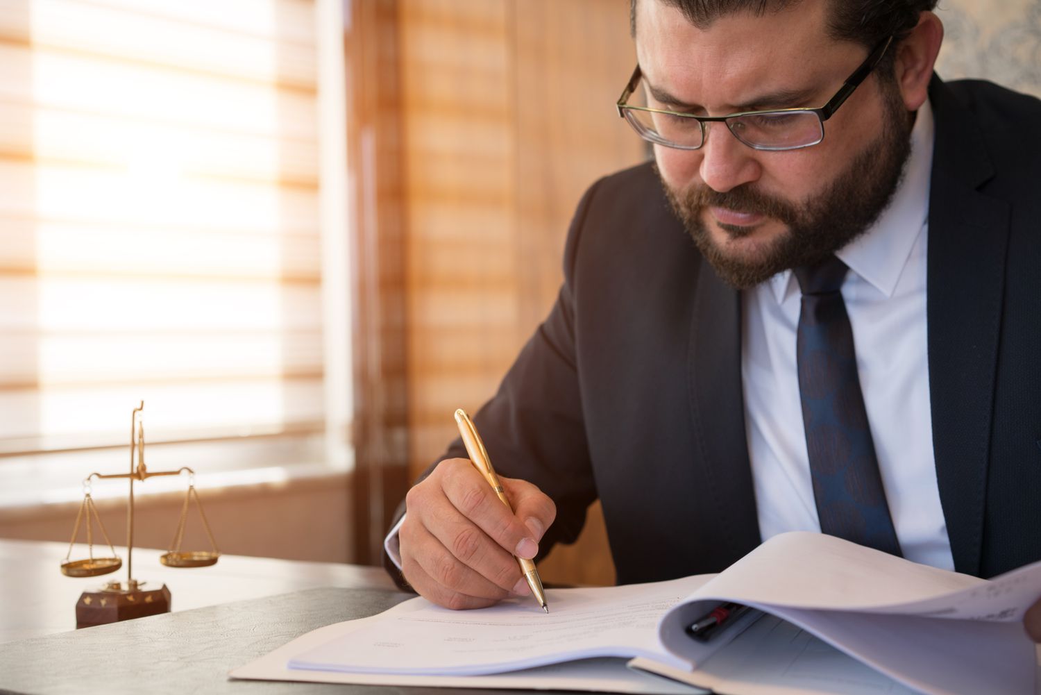 A company representative frowns as they sign a waiver of notice document.