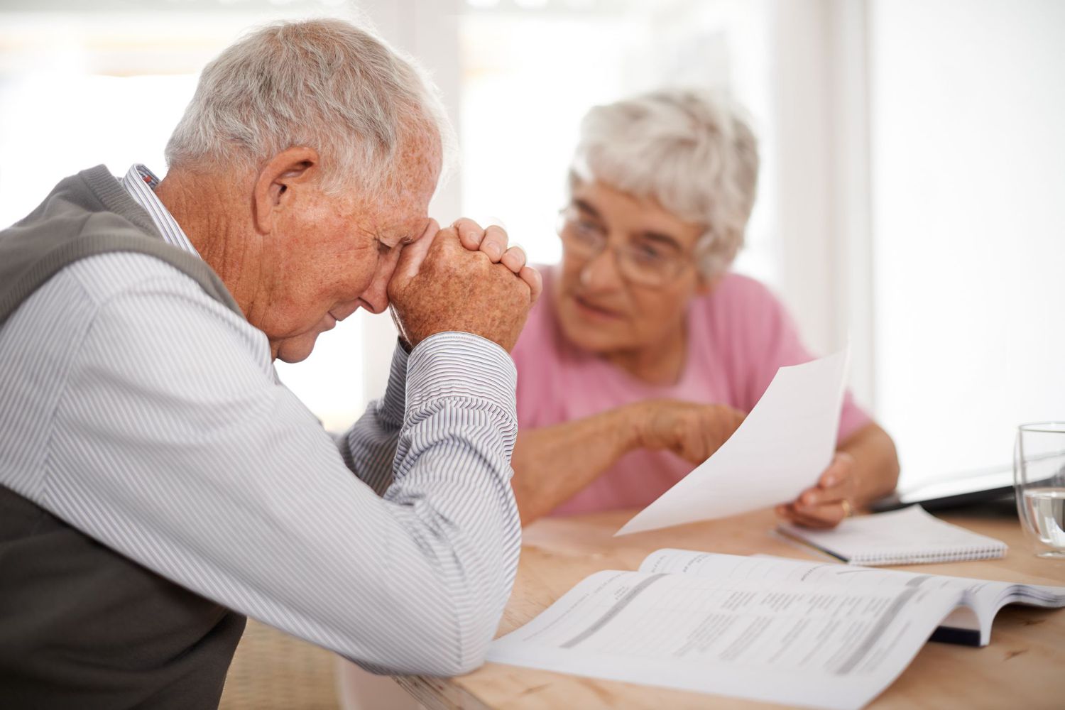 Upset couple reviewing papers