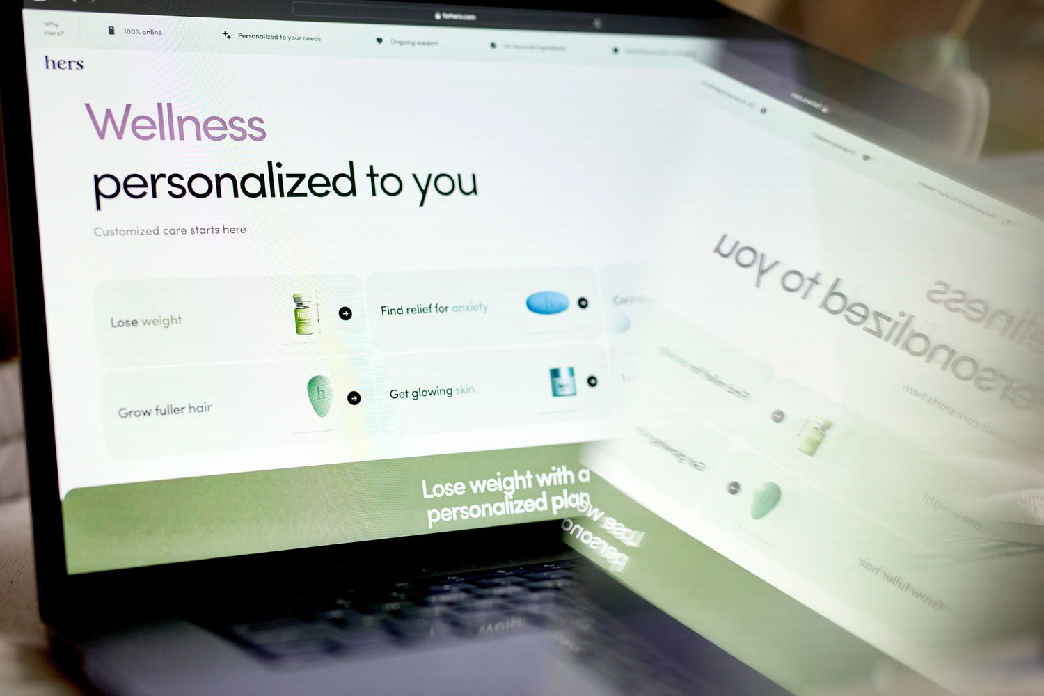 The Wellness screen of the Hers website is seen on the screen of a laptop.