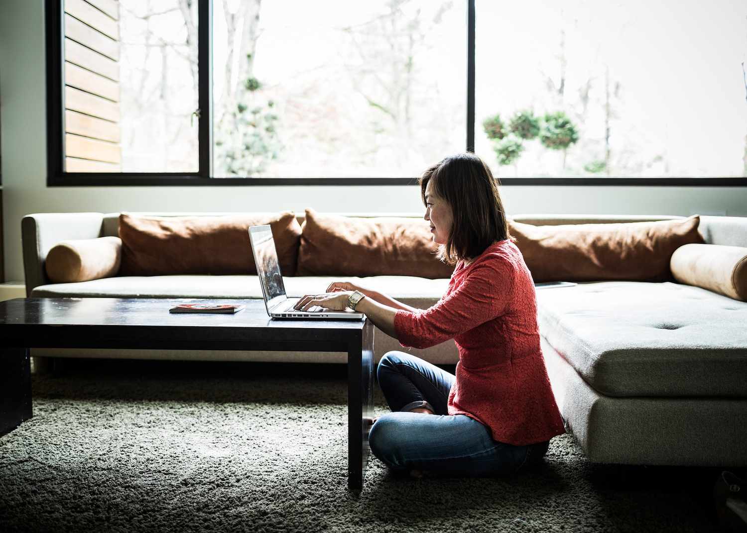 woman using laptop at home
