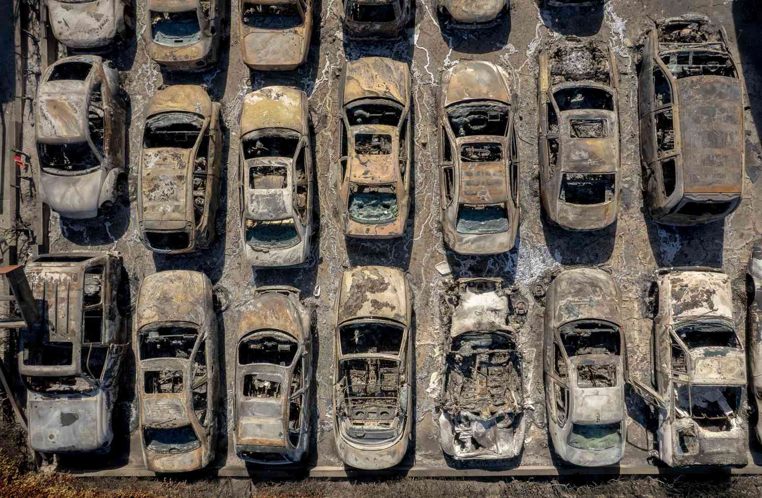 Burned vehicles at the Altadena Auto Center after the Eaton Fire in Altadena, California, US, on Monday, Jan. 20, 2025.