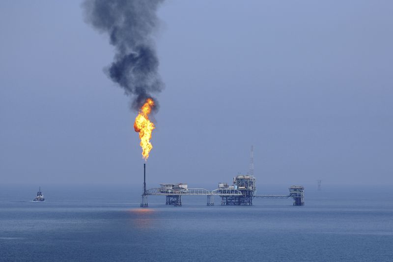 Burning gas in oil field in Gulf Sea.