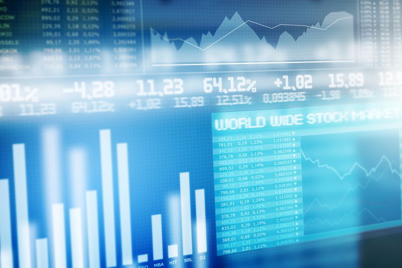 Stock market digital board with graphs and numbers.