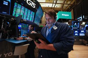 Traders work on the floor of the New York Stock Exchange