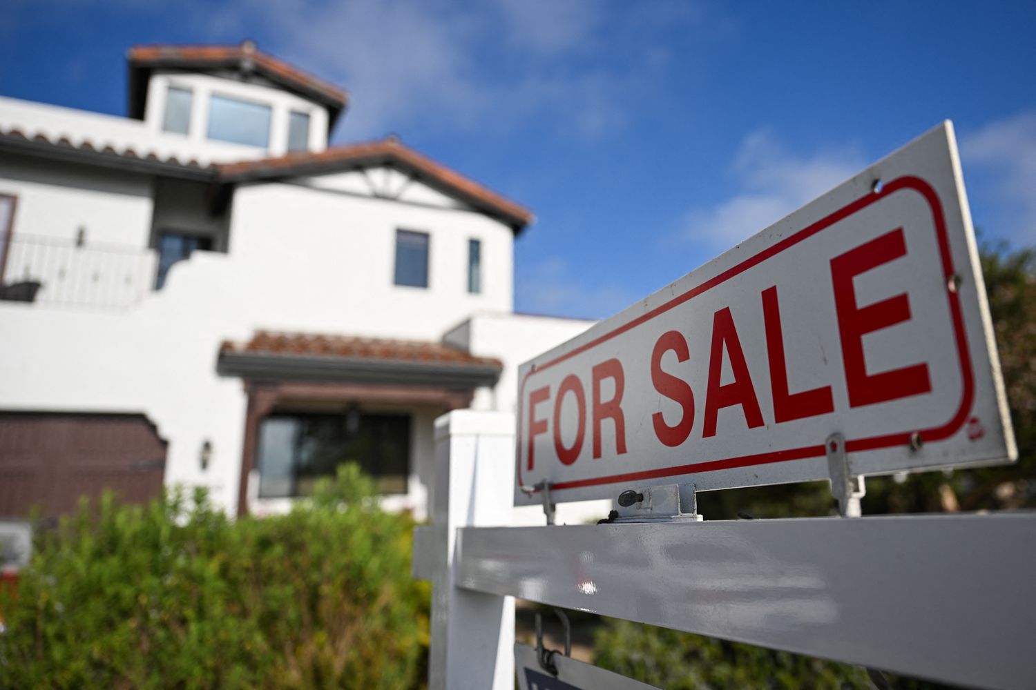 A "for sale" sign outside a house in Los Angeles in August. 
