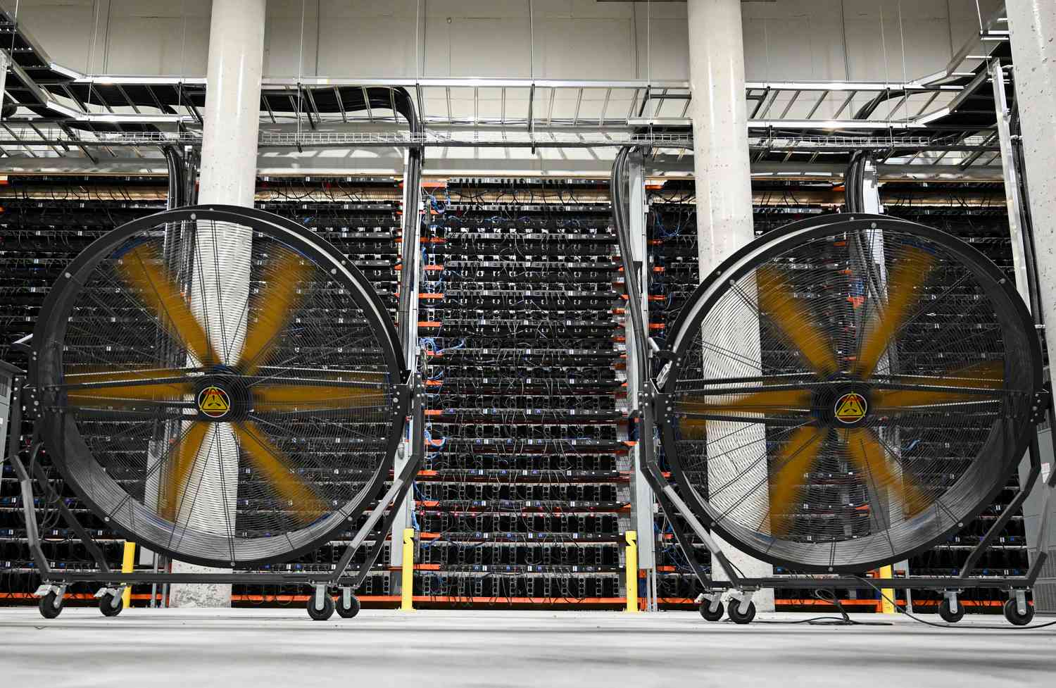 Fans cool cryptocurrency mining rigs at the Bitfarms Bunker facility in Sherbrooke, Quebec, Canada, on Monday, Sept. 9, 2024. 