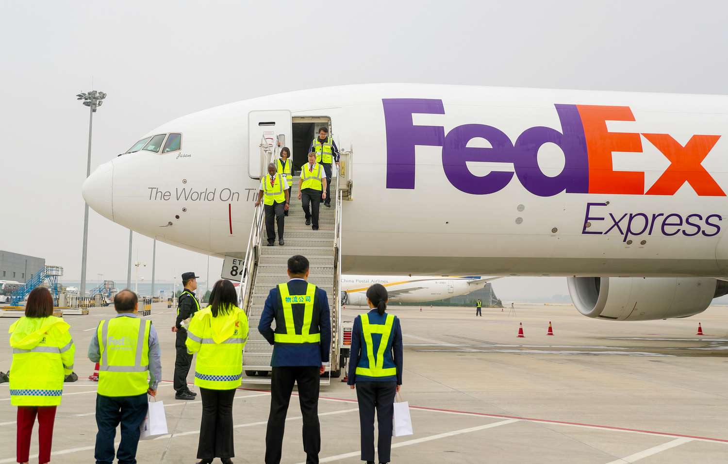 Crew members slowly step off the plane in Qingdao, China, on November 11, 2024.