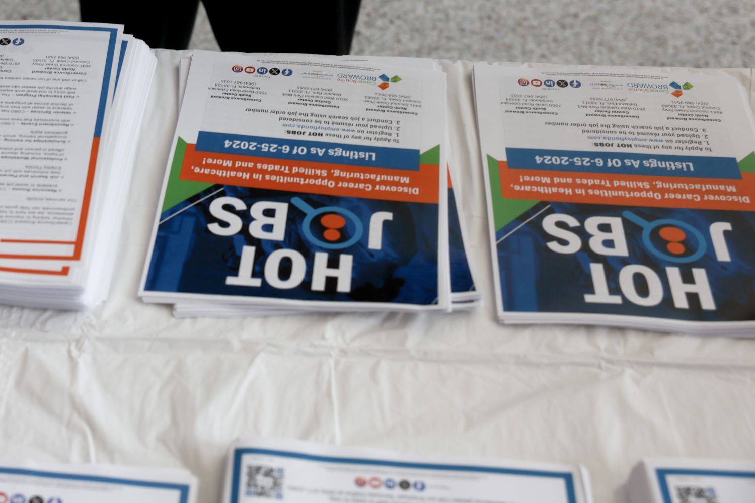 A company advertises to job seekers during the JobNewsUSA.com South Florida Job Fair