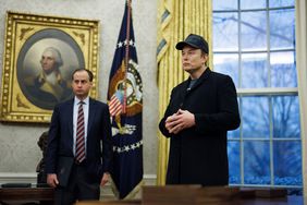 Elon Musk, chief executive officer of Tesla Inc., center, in the Oval Office of the White House.