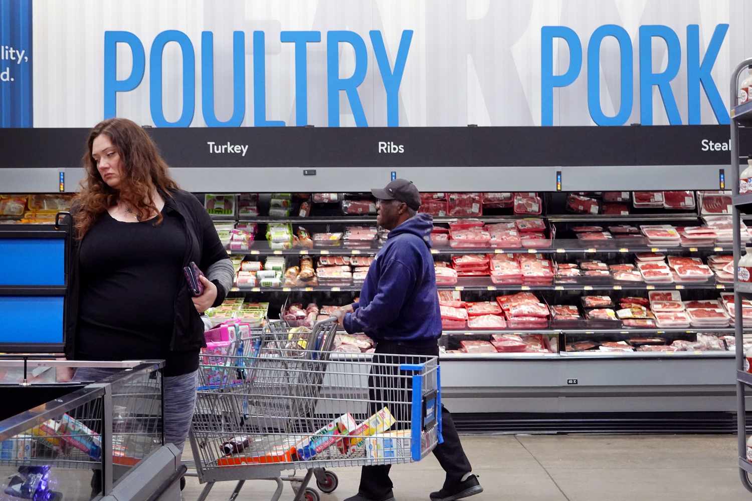 Customers shop at a Walmart store on May 18, 2023 in Chicago, Illinois. Walmart, the world's largest retailer, today reported first-quarter same-store sales growth that beat expectations and the company raised its full-year forecast