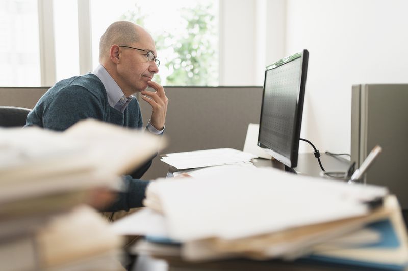 Mature businessman working in office