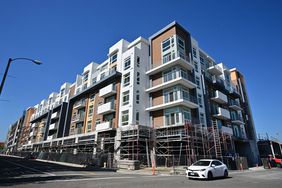 Road side view of an apartment building still under construction