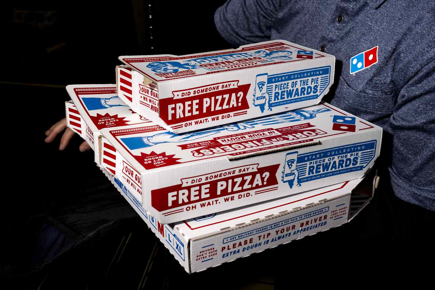 Pizzas are prepared for a delivery order at a Domino's restaurant in Trenton, Michigan