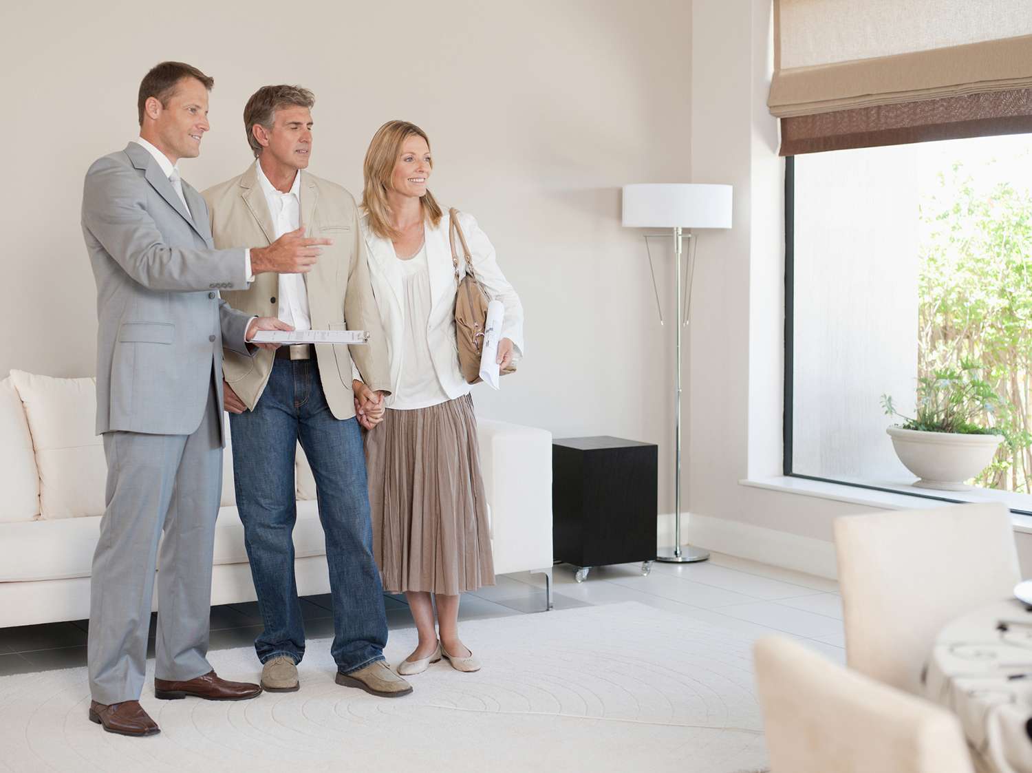Couple Talking With Interior Designer