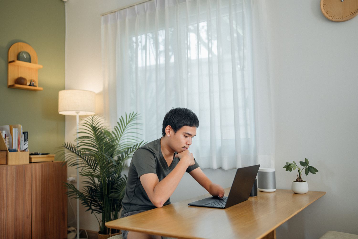 Man reviews personal loan application on computer
