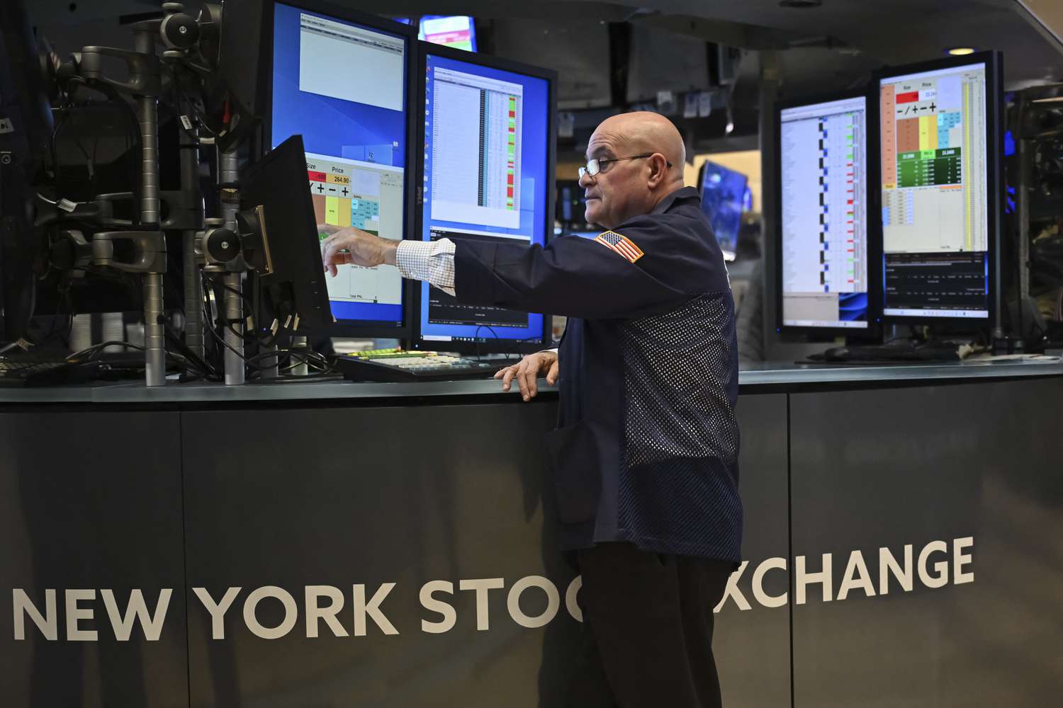 Traders work on the floor of the New York Stock Exchange.
