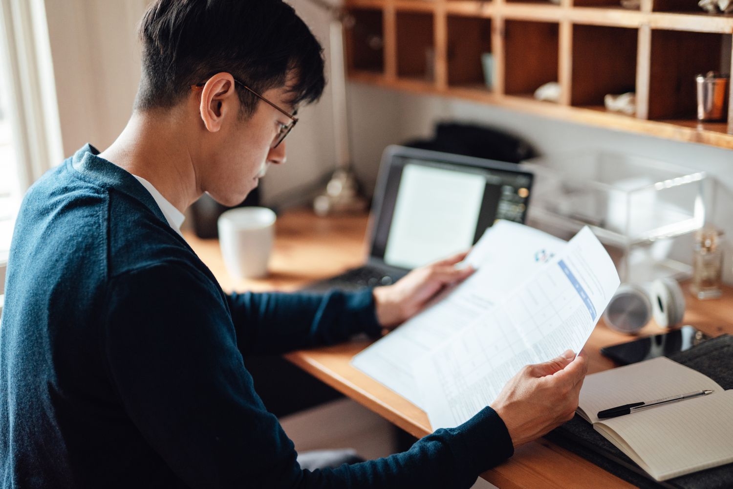 A man reviewing bills