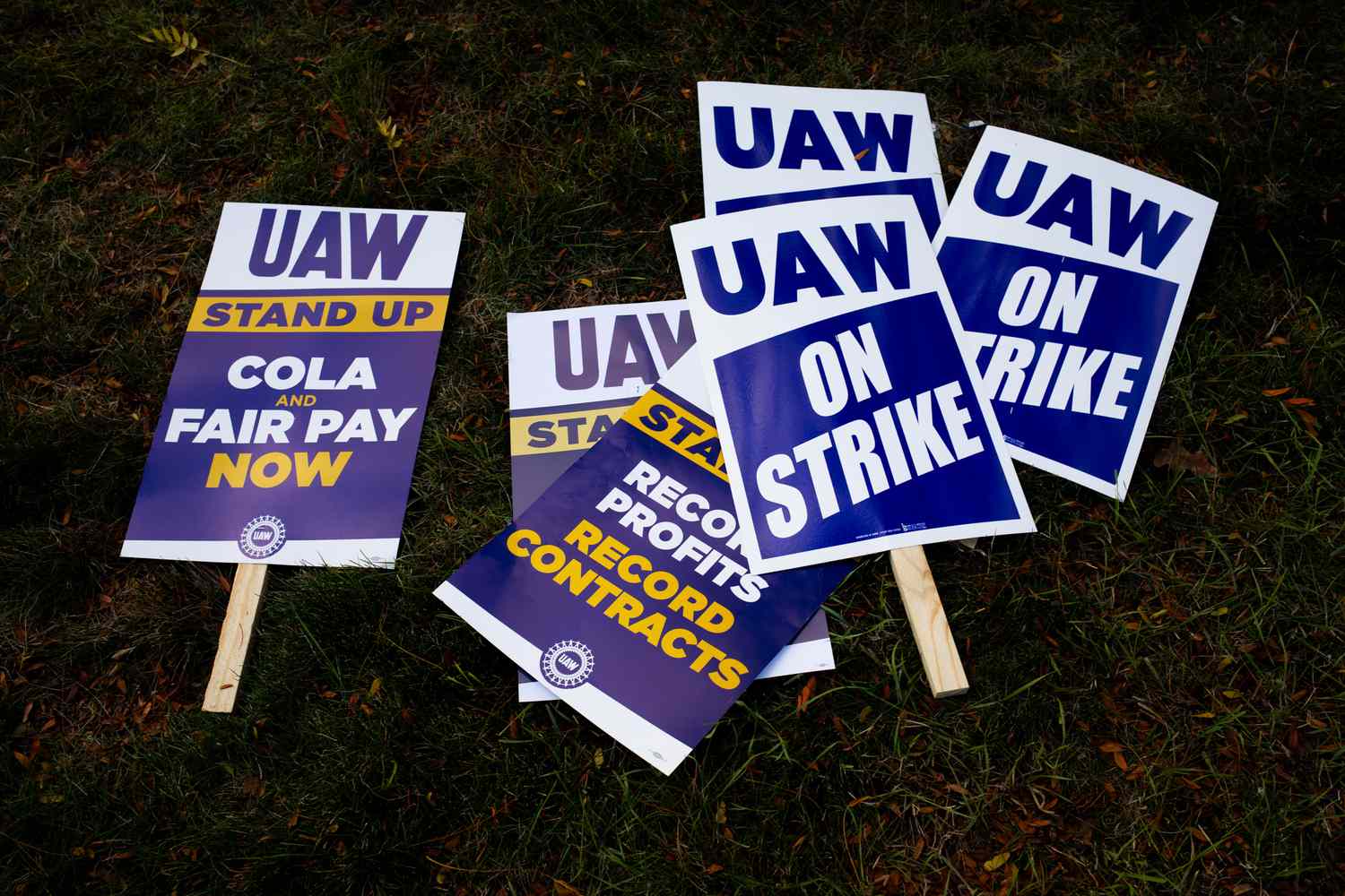 A "UAW On Strike" sign held on a picket line outside the Stellantis Sterling Heights Assembly Plant in Sterling Heights, Michigan