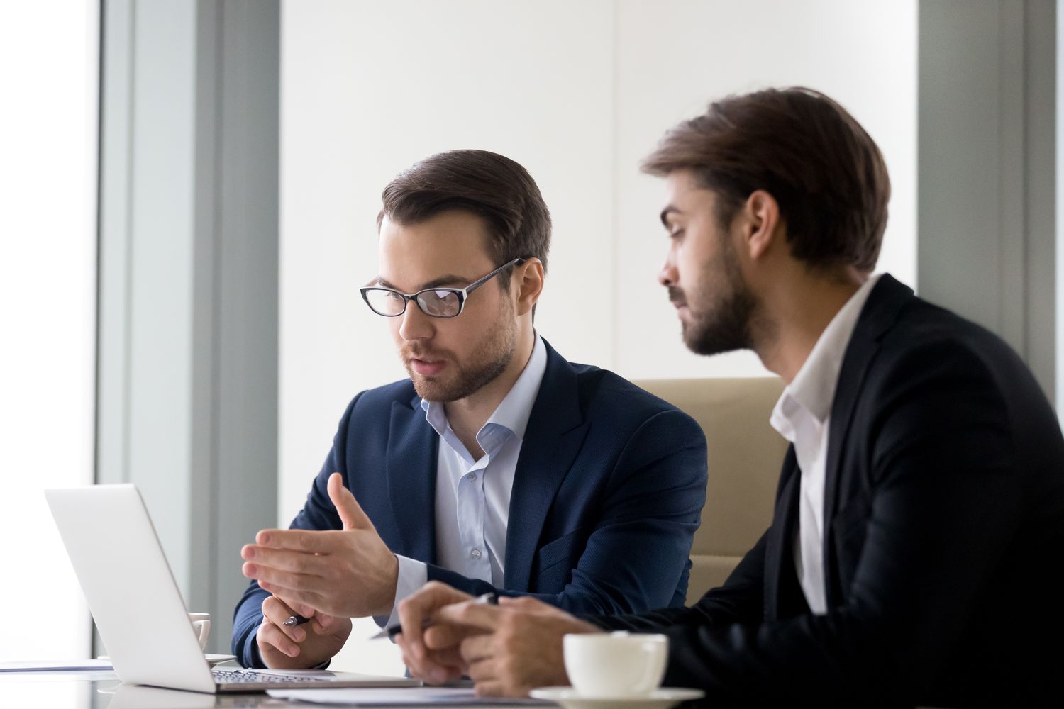 Two young men discussing deposit insurance