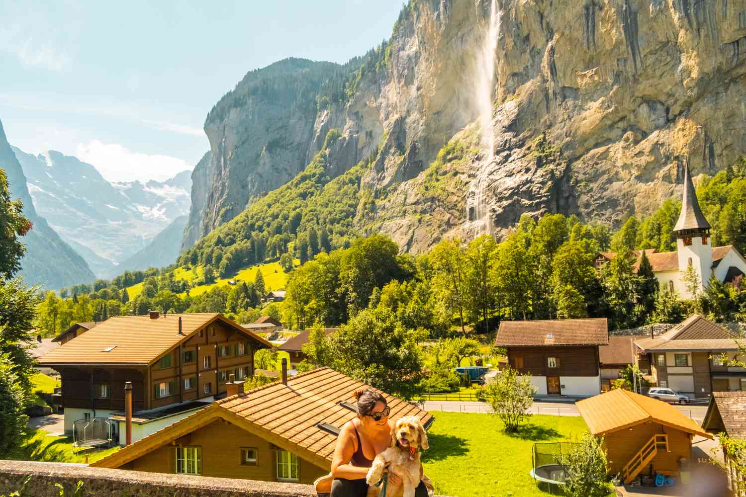 Picture of Lauterbrunnen, Bern, Switzerland with a person smiling at their doc in the foreground.
