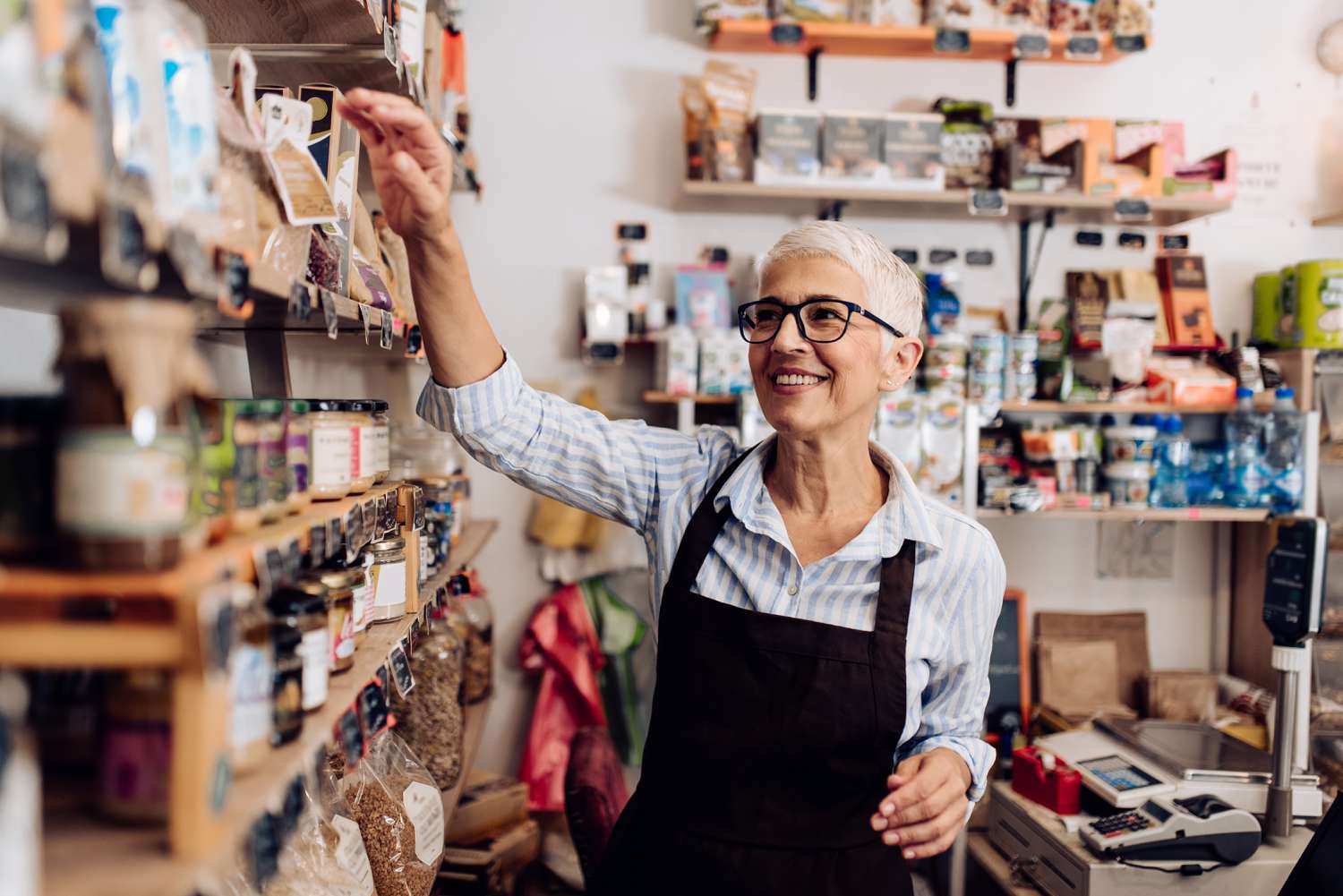 Portrait of a senior woman working at her dry goods store.