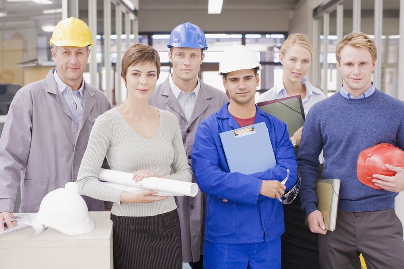 Workers with various jobs wear appropriate business attire.