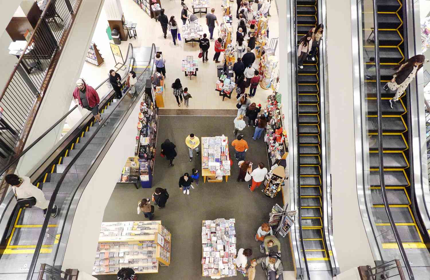 Shoppers in a store with escalators