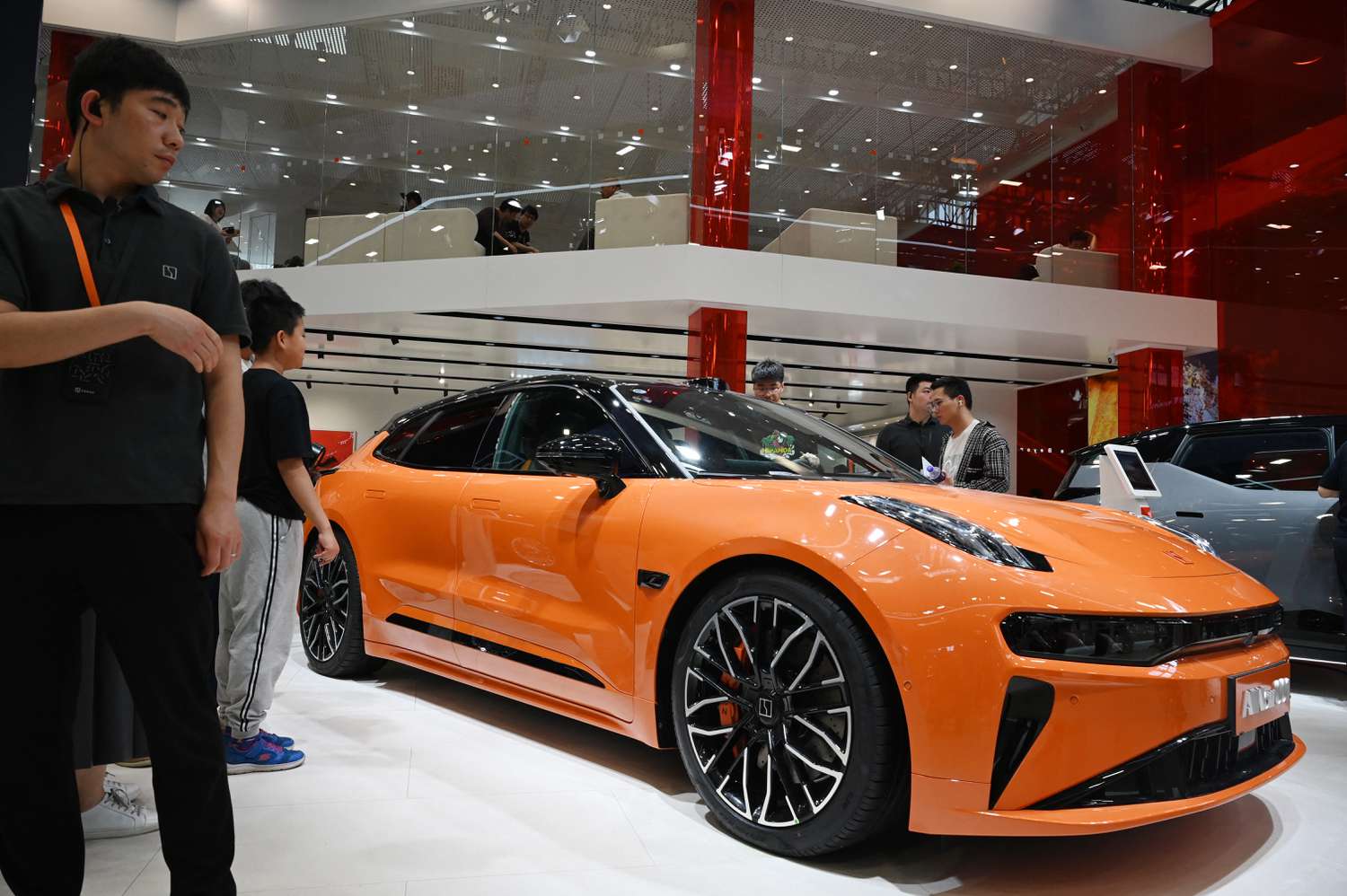 People look at a Zeekr 001 at the Beijing Auto Show in Beijing on May 3, 2024