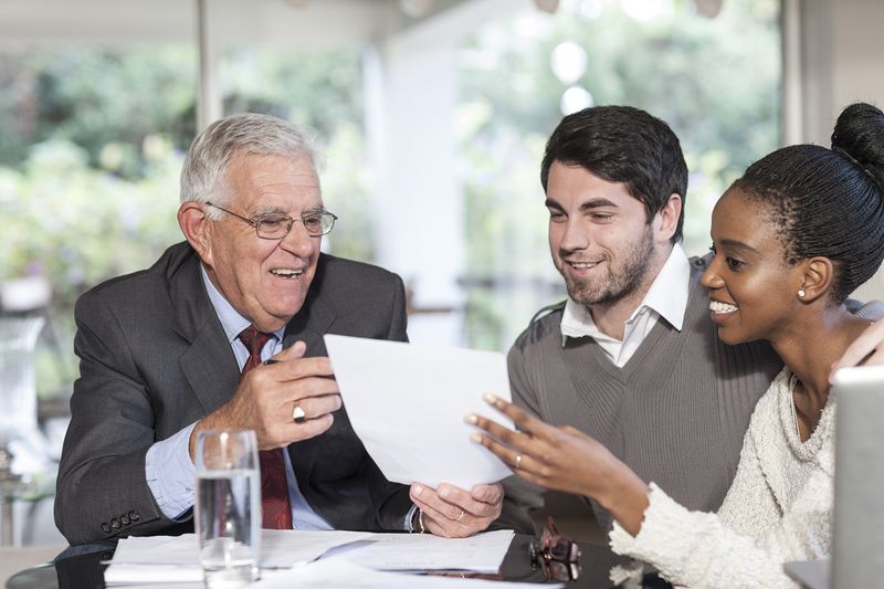 Young Couple Having a Meeting With a Salesman